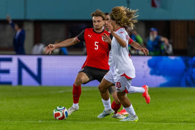 SOCCER - AUT vs TUN, test match VIENNA,AUSTRIA,01.JUN.26 - SOCCER - OEFB international test match, Austria vs Tunisia. Image shows Stefan Posch (AUT) and Hannibal Mejbri (TUN).  GEPAxpictures xPhilippxBrem