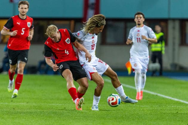 SOCCER - AUT vs TUN, test match VIENNA,AUSTRIA,01.JUN.26 - SOCCER - OEFB international test match, Austria vs Tunisia. Image shows Xaver Schlager (AUT) and Hannibal Mejbri (TUN).  GEPAxpictures xPhilippxBrem
