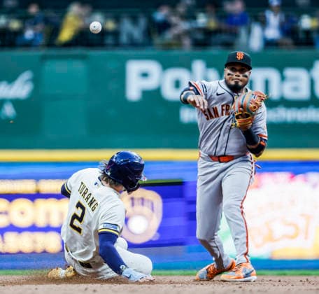 San Francisco Giants second baseman Luis Arraez (R) forces out Milwaukee Brewers second baseman Brice Turang and turns a double play on Milwaukee Brewers catcher William Contreras in the fourth inning of the MLB, Baseball Herren, USA game between the San Francisco Giants and the Milwaukee Brewers at American Family Field in Milwaukee, Wisconsin on Monday, June 1, 2026.  MIL20260601819 TANNENxMAURY