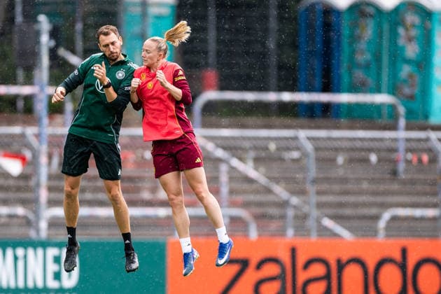 COLOGNE, GERMANY - JUNE 02: Julius Balsmeier (Athletics Coach Germany) and Lea Schueller (Schüller, Schuller, Germany, 11) jumping against each other during a training session prepare for the UEFA European Qualifiers for the FIFA Women™s World Cup 2027 between Germany vs. Norway at Sportpark Hoehenberg on June 02, 2026 in Mainz, Germany. North Rhine Westphalia Germany Copyright: xSteffiexWunderlx