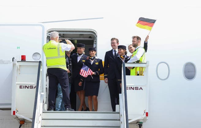 02 06 2026, Football DFB national team, Departure of the German national football team from Frankfurt Airport with Lufthansa plane LH 434 to the 2026 World Cup in the USA to Chicago, v l , airplane crew having their picture taken on the stairs with the German flag DFL DFB REGULATIONS PROHIBIT ANY USE OF PHOTOGRAPHS AS IMAGE SEQUENCES AND OR QUASI VIDEO xdcx Copyright: HMBxMedia Claus