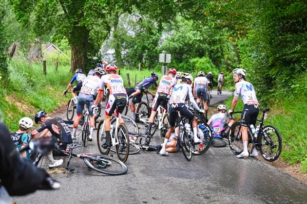 Tour de Wallonie 2026 Stage 2 LIBRAMONT-CHEVIGNY, BELGIUM - JUNE 02 : crash in the peloton during stage 2 of the 47th edition of Ethias Tour de Wallonie an UCI ProSeries 2.Pro cycling road race stage for Men Elite of 192.1 km with start in Jodoigne and finish in Libramont-Chevigny on June 2, 2026 in Libramont-Chevigny, Belgium, 02 06 2026 ( Motordriver Pieter Van Herzele - Libramont-Chevigny Belgium  Copyright: xVincentxKalutx