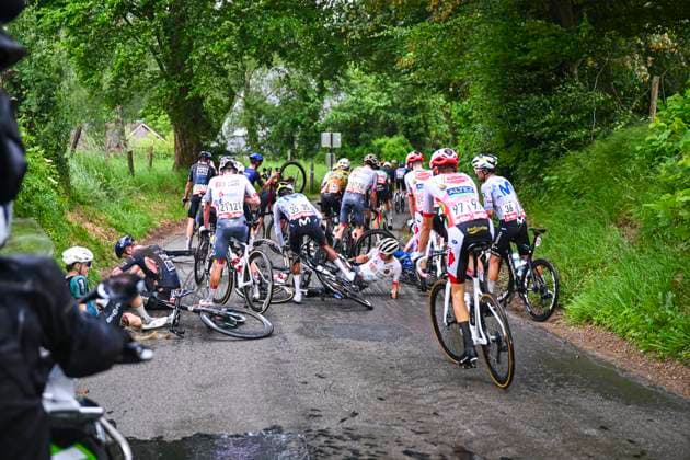 Tour de Wallonie 2026 Stage 2 LIBRAMONT-CHEVIGNY, BELGIUM - JUNE 02 : crash in the peloton during stage 2 of the 47th edition of Ethias Tour de Wallonie an UCI ProSeries 2.Pro cycling road race stage for Men Elite of 192.1 km with start in Jodoigne and finish in Libramont-Chevigny on June 2, 2026 in Libramont-Chevigny, Belgium, 02 06 2026 ( Motordriver Pieter Van Herzele - Libramont-Chevigny Belgium  Copyright: xVincentxKalutx