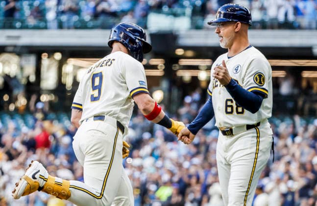 Milwaukee Brewers first baseman Jake Bauers (L) celebrates with Milwaukee Brewers third base coach Matt Erickson (R) after hitting a three RBI home run in the first inning of the MLB, Baseball Herren, USA game between the San Francisco Giants and the Milwaukee Brewers at American Family Field in Milwaukee, Wisconsin on Tuesday, June 2, 2026.  MIL20260602812 TANNENxMAURY