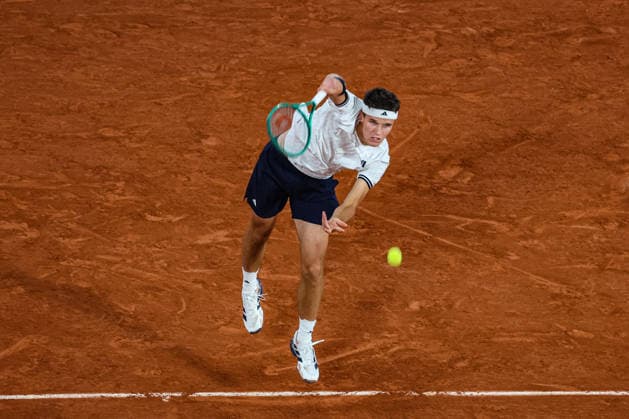 (260603) -- PARIS, June 3, 2026 -- Jakub Mensik hits a return during the men s singles quarterfinal match between Jakub Mensik of the Czech Republic and Joao Fonseca of Brazil at the French Open tennis tournament at Roland Garros, Paris, France, June 2, 2026. (Photo by Xinhua) (SP)FRANCE-PARIS-TENNIS-FRENCH OPEN-MEN S SINGLES-QUARTERFINAL GlennxGervot 