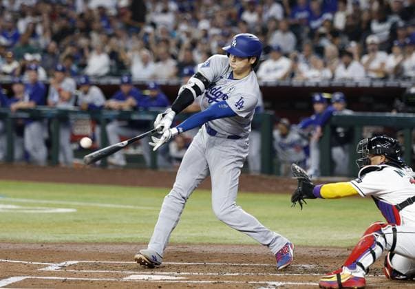Baseball: Dodgers vs. Diamondbacks Los Angeles Dodgers designated hitter Shohei Ohtani hits a two-run triple in the second inning of a baseball game against the Arizona Diamondbacks at Chase Field in Phoenix, Arizona, on June 2, 2026.  A14AA0005617500P