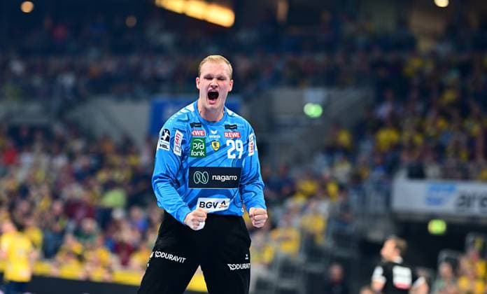 Goalkeeper David Späth 29 Rhein Neckar Löwen raises his fists and cheers loudly In the background, spectators dressed in yellow can be seen in a packed hall David Späth 29 Rhein Neckar Löwen cheers emotionally Copyright: xMichaelxGelhardtx