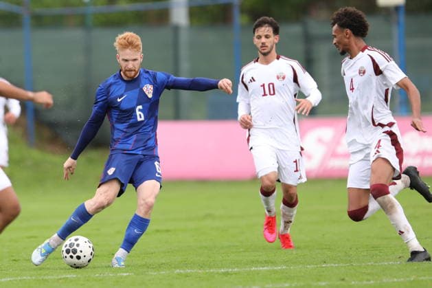 Fußball, U21, Testspiel, Kroatien - Katar Croatia, Zagreb, 030626. Rudes Stadium. Friendly match of the U21, U 21 national teams: Croatia - Qatar. In the photo: Luka Vrbanic, Salem Reda Salem. Photo: Ranko Suvar CROPIX Zagreb Croatia Copyright: xxRankoxSuvarx hrvatska_katar41-030626
