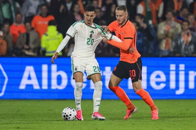 ROTTERDAM , 03-06-2026 , Stadium Feijenoord de Kuip , season 2025 2026 , FIFA International football , friendly match between The Netherlands and Algeria , picture shows Algeria player Adil Boulbina and Netherlands player Teun Koopmeiners Netherlands - Algeria (friendly)  x204135807x Copyright: