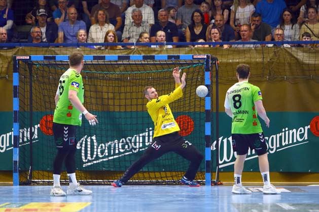 Defensive save by goalkeeper Oliver Krechel Emsdetten , left Marius Kluwe Emsdetten , right Bjarne Budelmann Emsdetten Handball Qualification match for the 2 League EHV Aue TV Emsdetten 36 44 on 3 6 2026 EHV Aue TV Emsdetten