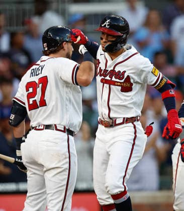 Left fielder Mauricio Dubon 14 of the Atlanta Braves celebrates with third baseman Austin Riley 27 after Dubon hit a 3-run home run in the third inning against the Toronto Blue Jays at Truist Park on Wednesday, June 3, 2026 in Atlanta, Georgia.  ATL20260603111 MikexZarrilli