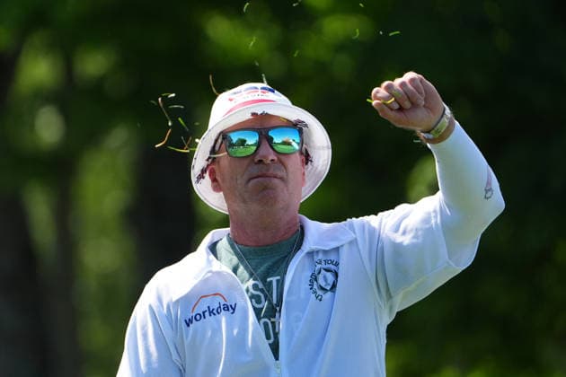 DUBLIN, OH - JUNE 04: Mark Carens caddie for J.J. Spaun of United States cheeks the wind while standing on the 5th tee during first round of the Memorial Tournament on June 04, 2026 at the Muirfield Village Golf Club in Dublin, Ohio. (Photo by Jason Mowry Icon Sportswire) GOLF: JUN 04 PGA, Golf Herren the Memorial Tournament presented by Workday EDITORIAL USE ONLY Icon260604037