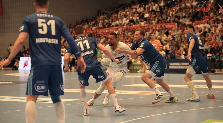 Photo Philipp AHOUANSOU Wetzlar against Nicolaj Jorgensen 11 and right Niklas WELLER HSV Handball Men 1 Bundesliga 33 Matchday on Thu 04 06 2026 HSV Handball HSG Wetzlar