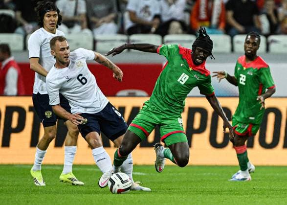 Russia Soccer Friendly Russia - Burkina Faso 9183233 05.06.2026 Russia s Dmitry Barinov and Burkina Faso s Georgi Minoungou struggle for a ball during the friendly soccer match between Russia and Burkina Faso at Volgograd Arena stadium, in Volgograd, Russia. Maksim Blinov Sputnik Volgograd Russia  Copyright: xMaksimxBlinovx