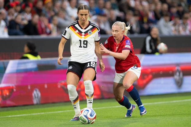 Klara Buehl 19 Germany on the ball against Caroline Graham Hansen 10 Norway , Germany vs Norway, Soccer, Womens World Cup Qualification, Group stage, Group D, Matchday 5 of 6, 2025 2026, 05 06 2026 DFB regulations prohibit any use of photographs as image sequences and or quasi video Koeln Nordrhein Westfalen Germany Copyright: xkolbert-press MarkusxVerwimpx