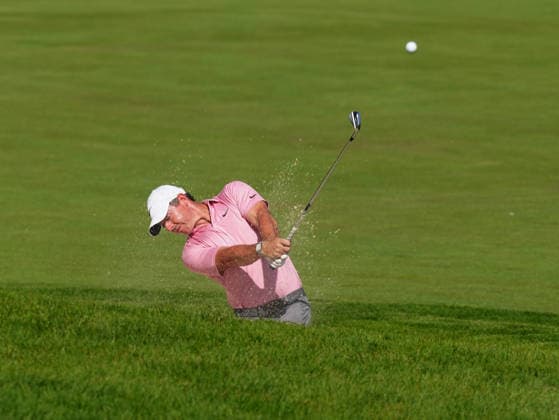 DUBLIN, OH - JUNE 05: PGA, Golf Herren golfer Rory McIlroy plays his second shot out of a fairway bunker on the 15th hole on June 5, 2026 during the second round of the Memorial Tournament presented by Workday at Muirfield Village Golf Club in Dublin, Ohio. (Photo by Brian Spurlock Icon Sportswire) GOLF: JUN 05 PGA the Memorial Tournament presented by Workday EDITORIAL USE ONLY Icon26060527