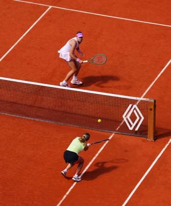 Mirra Andreeva and Maja Chwalinska in singles final action at the net French Open Tennis, Day Fourteen, Tennis, Roland Garros, Paris, France - 06 Jun 2026Paris Roland Garros France EDITORIAL USE ONLY No use with unauthorised audio, video, data, fixture lists, club league logos or live services. Online in-match use limited to 120 images, no video emulation. No use in betting, games or single club league player publications.  Copyright: xJavierxGarcia Shutterstockx 16906570o