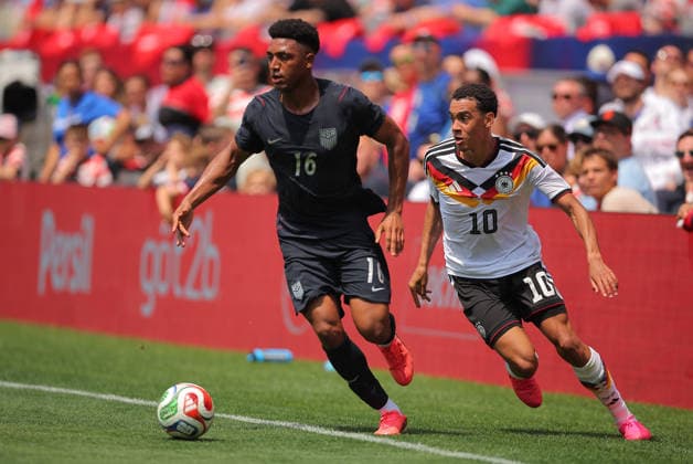CHICAGO, IL - JUNE 06: Alex Freeman 16 of the United States controls the ball against Jamal Musiala 10 of Germany during a friendly match on June 6, 2026 at Soldier Field in Chicago, Illinois. (Photo by Melissa Tamez Icon Sportswire) SOCCER: JUN 06 USA vs Germany EDITORIAL USE ONLY Icon260606010