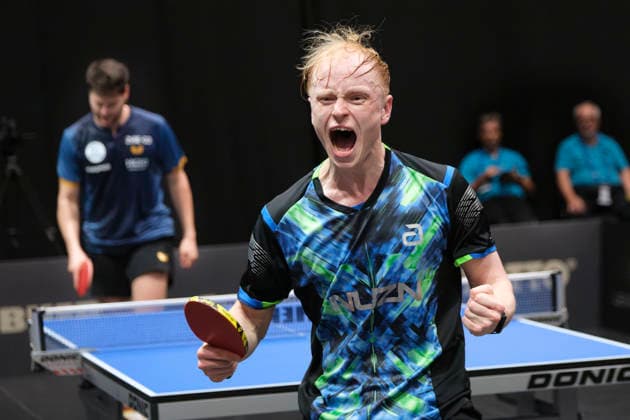 Huge sensation at the 2026 LOTTO Thüringen TT-Finals at Messe Erfurt: Andre Bertelsmeier (foreground) ecstatic after his sensational 4-3 quarter-final victory over top favorite Dimitrij Ovtcharov (background); a pure expression of sporting triumph, underdog victory, and emotion in competitive Table tennis, Tischtennis Deutschland, Germany 260606-DSCF5779