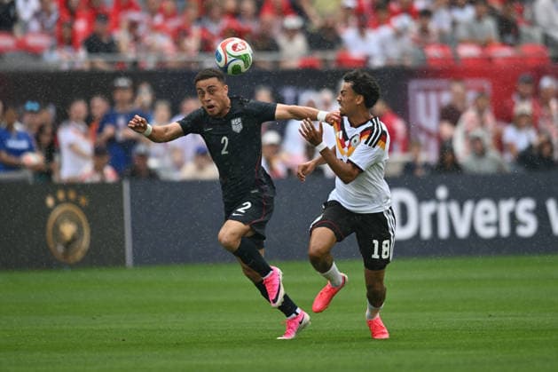 CHICAGO, IL - JUNE 06: United States right back Sergino Dest (2) and Germany defender Nathaniel Brown (18) battle for the ball during a friendly match between the United States and Germany on June 6, 2026, at Soldier Field in Chicago, IL. (Photo by Patrick Gorski Icon Sportswire) SOCCER: JUN 06 USA vs Germany EDITORIAL USE ONLY Icon260606019