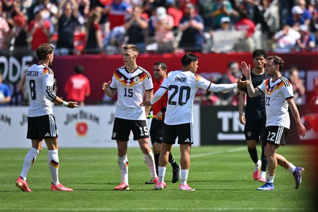 CHICAGO, IL - JUNE 06: Germany defensive midfielder Leon Goretzka (8), defender Nico Schlotterbeck (15), midfielder Nadiem Amiri (20) and left back David Raum (22) celebrate after their victory in a friendly match against the United States on June 6, 2026, at Soldier Field in Chicago, IL. (Photo by Patrick Gorski Icon Sportswire) SOCCER: JUN 06 USA vs Germany EDITORIAL USE ONLY Icon260606042