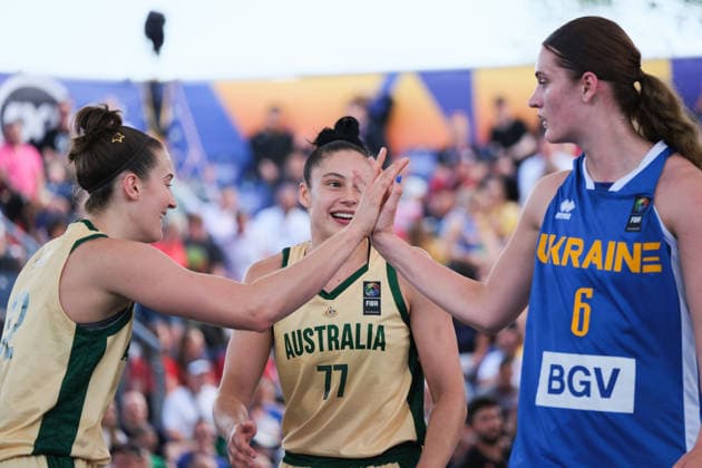 June 6, 2026, Warsaw, Masovian Voivodeship, Poland: Australia s HANNAH HANK (12) high fives Ukraine s KATERYNA KOVAL (6) as Australia s EMMA CLARKE (77) smiles in victory at the end of a FIBA 3x3 Basketball World Cup women s quarter-final game between Australia and Ukraine in Warsaw, Poland. Basketball 2026: FIBA 3x3 World Cup Women s Quarterfinal: Australia 21:10 Ukraine  - ZUMAk204 20260606_zip_k204_051 Copyright: xRomanxKozielx