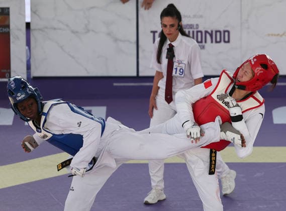 (260607) -- ROME, June 7, 2026 -- Mu Wenzhe (R) of China competes with Kimi Laurene Ossin (L) of Cote d Ivoire during their women s +67kg final match at Roma 2026 World Taekwondo Grand Prix in Rome, Italy, June 6, 2026. ) (SP)ITALY-ROME-TAEKWONDO-ROMA 2026 GRAND PRIX-WOMEN S +67KG LixJing 