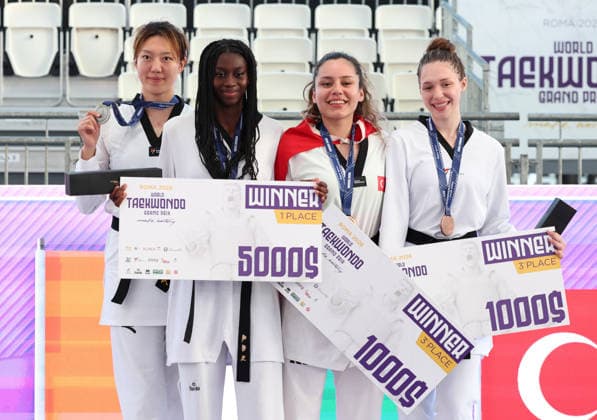 (260607) -- ROME, June 7, 2026 -- (from L to R) Silver medalist Mu Wenzhe of China, gold medalist Kimi Laurene Ossin of Cote d Ivoire, bronze medalists Sude Yaren Uzuncavdar of T¨¹rkiye and Anastasiia Kosmycheva of Russia pose during the awarding cerenomy of women s +67kg event at Roma 2026 World Taekwondo Grand Prix in Rome, Italy, June 6, 2026. ) (SP)ITALY-ROME-TAEKWONDO-ROMA 2026 GRAND PRIX-WOMEN S +67KG LixJing 
