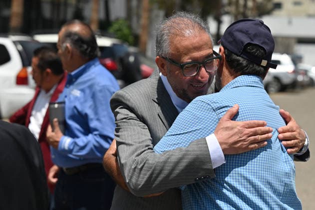Iran Ambassador Attends World Cup Team Arrival press conference, PK, Pressekonferenz in Tijuana Iran s ambassador to Mexico, Abolfazl Pasandideh, embraces a member of the Chamber of Commerce in Tijuana (CANACO) during a tour of imported car lots after a press conference ahead of the arrival of the national football team for the FIFA 2026 World Cup tournament, in Tijuana, Baja California, Mexico, on June 6, 2026. Tijuana BAJA CALIFORNIA Mexico  Copyright: xCarlosxMorenox originalFilename:moreno-iraniana260606_npEPx.jpg