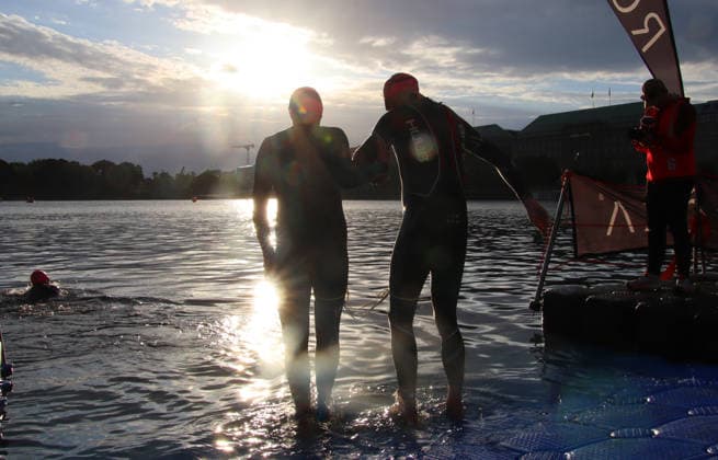 Ironman in Hamburg 2026 Visually impaired Rob Sears r with his guide Ant Munson l at the swim start in the Inner Alster lake