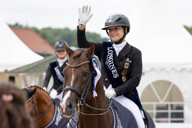Isabell WERTH GER on Viva Gold OLD, is happy about her 20th German Championship, joy, laughter, at the award ceremony, single picture, Dressage 03 Longines Grand Optimum Prize, German Championship Grand Prix Kuer 2026, Dressage, Balve Germany, on 07 06 2026 Â