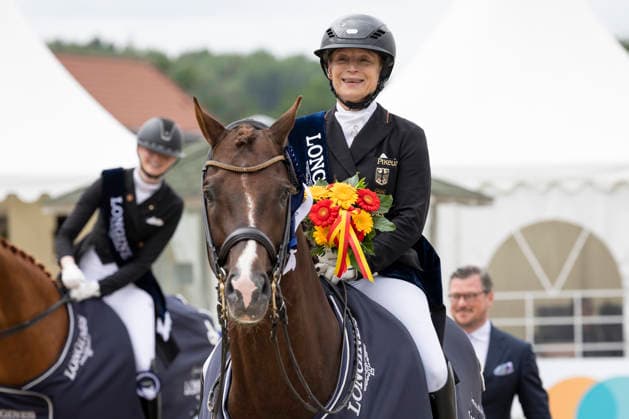 Isabell WERTH GER on Viva Gold OLD, is happy about her 20th German Championship, joy, laughter, at the award ceremony, single picture, Dressage 03 Longines Grand Optimum Prize, German Championship Grand Prix Kuer 2026, Dressage, Balve Germany, on 07 06 2026 Â