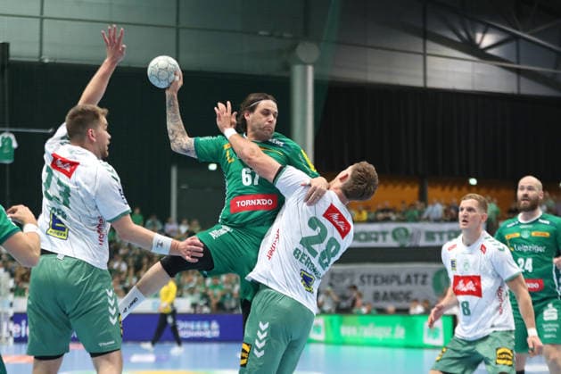 Handball DAIKIN HBL, SC DHfK Leipzig GWD Minden 07 06 2026 Dean Bombac 67, SC DHfK Leipzig is stopped by Tom Bergner 28, GWD Minden Handball, DAIKIN HBL, 1 Bundesliga, Season 2025 2026, 34 Matchday SC DHfK Leipzig vs GWD Minden on 07 06 2026 at Quarterback Immobilien Arena Leipzig Copyright: xBEAUTIFULxSPORTS JanxKaeferx