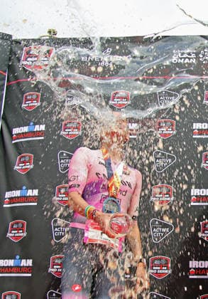 Ironman in Hamburg 2026 Beer shower after the award ceremony Laura Philipp Germany comes second