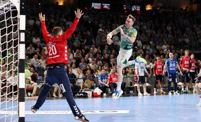 Lasse Andersson scores a goal against goalkeeper Kevin Moeller duel Game scene Action Sport Handball HBL Bundesliga Men 34 Matchday Season 2025 2026 07 06 2026 Füchse Berlin vs SG Flensburg Handewitt