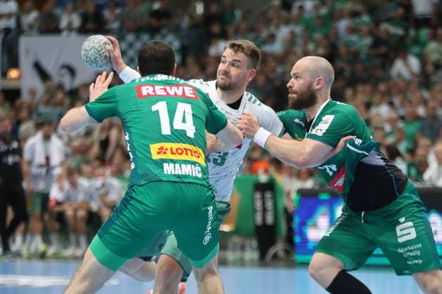 Handball DAIKIN HBL, SC DHfK Leipzig GWD Minden 07 06 2026 Ian Weber 13, GWD Minden is attacked by Moritz Preuss 24, SC DHfK Leipzig Handball, DAIKIN HBL, 1 Bundesliga, Season 2025 2026, 34 Matchday SC DHfK Leipzig vs GWD Minden on 07 06 2026 at Quarterback Immobilien Arena Leipzig Copyright: xBEAUTIFULxSPORTS JanxKaeferx