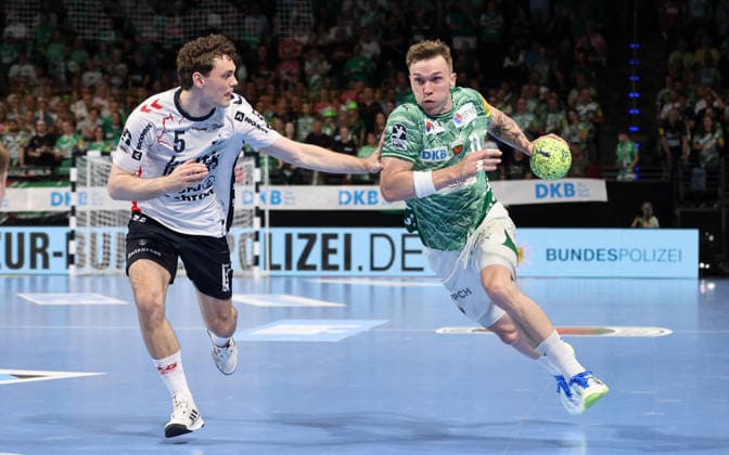Niclas Kirkeloekke, Lasse Andersson on the ball duel Match scene Action Sport Handball HBL Bundesliga Men 34 Matchday Season 2025 2026 07 06 2026 Füchse Berlin vs SG Flensburg Handewitt