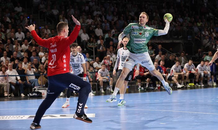 Mathias Gidsel scores a goal against goalkeeper Kevin Moeller duel Game scene Action Sport Handball HBL Bundesliga Men 34 Matchday Season 2025 2026 07 06 2026 Füchse Berlin vs SG Flensburg Handewitt