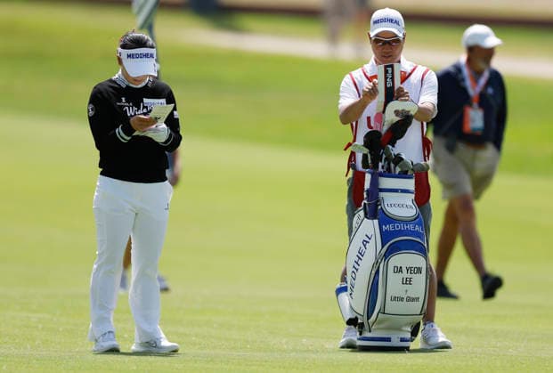 Da Yeon Lee of South Korea and her caddie look over their notes on the second fairway during the final round of the 81st Women s U.S. Open golf championship at the Riviera Country Club in Pacific Palisades, California, on Sunday, June 7, 2026.  GLP20260607901 CAROLINExBREHMAN