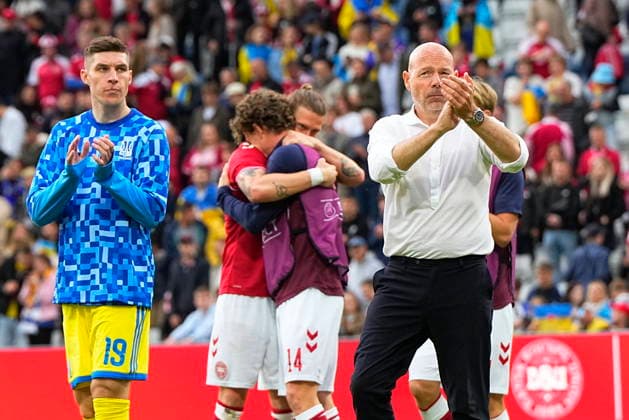 DENMARK National Team Test Match Denmark Ukraine Denmark s national coach Brian Riemer surrounded by players The football match between Denmark and Ukraine at Odense Stadium on Sunday, June 7, 2026 Christian Eriksen was able to leave the field on his own after collapsing on the grass in the second half of Denmark s test match against Ukraine The Danish player had received treatment but was able to walk to the ambulance that had driven onto the stadium Shortly after, the referee ended the match early Photo Bo Amstrup Scanpix 2026 , Odense Denmark  Copyright: BoxAmstrupx spdk20260607-201556-L