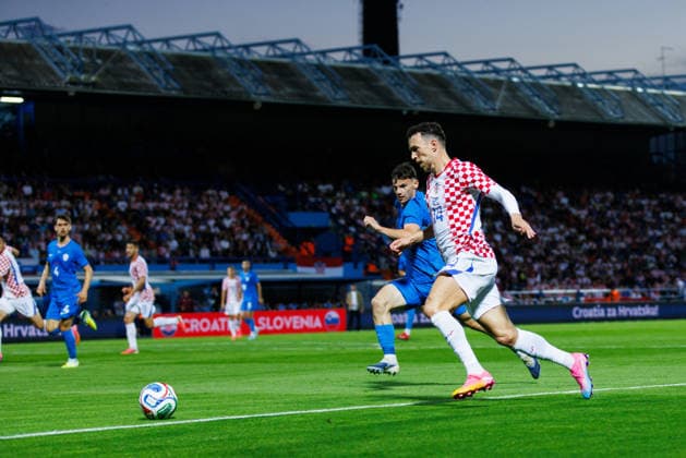 Pre World cup international friendly 2026 match between Croatia and Slovenia Ivan Perisic Croatia 14 and Srdan Kuzmic Slovenia 5 seen in action during Pre World cup international friendly 2026 football match between Croatia and Slovenia, Stadium Varteks, Varazdin, Croatia 07 06 2026 Copyright: xBEAUTIFULxSPORTS Bosnjakovicx