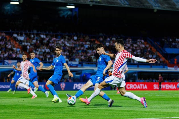 Pre World cup international friendly 2026 match between Croatia and Slovenia Ivan Perisic Croatia 14 and Srdan Kuzmic Slovenia 5 seen in action during Pre World cup international friendly 2026 football match between Croatia and Slovenia, Stadium Varteks, Varazdin, Croatia 07 06 2026 Copyright: xBEAUTIFULxSPORTS Bosnjakovicx