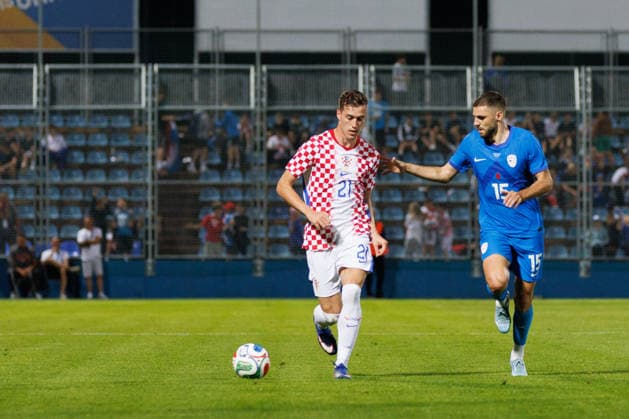 Pre World cup international friendly 2026 match between Croatia and Slovenia Luka Sucic Croatia 21 and Danijel Sturm Slovenia 15 seen in action during Pre World cup international friendly 2026 football match between Croatia and Slovenia, Stadium Varteks, Varazdin, Croatia 07 06 2026 Copyright: xBEAUTIFULxSPORTS Bosnjakovicx