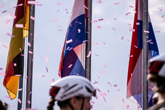 37th Giro d Italia Women 2026 - Stage 9 National flags, pink confetti, and helmets are seen during stage 9 of the 2026 Giro d Italia Femminile in Saluzzo, Italy, on June 7, 2026. Saluzzo Italy  Copyright: xAndreaxxAmatox originalFilename:amato-notitle260607_np9be.jpg