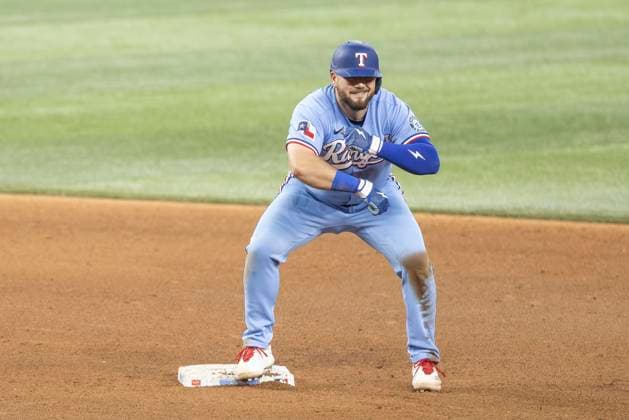 June 7, 2026, Arlington, Texas, USA: Texas Rangers first baseman JAKE BURGER (21) celebrates after hitting a double during a MLB, Baseball Herren, USA game between the Cleveland Guardians and Texas Rangers at Globe Life Field. Texas wins 10-0. MLB 2026: Rangers 10:0 Guardians  - ZUMAf180 20260607_zsp_f180_011 Copyright: xMarkxFannx