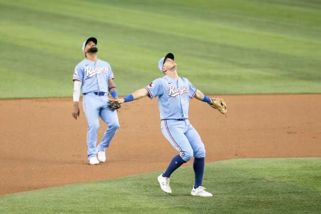 June 7, 2026, Arlington, Texas, USA: Texas Rangers third baseman JOSH JUNG (6) waves off Texas Rangers shortstop EZEQUIEL DURAN (20) on a pop fly during a MLB, Baseball Herren, USA game between the Cleveland Guardians and Texas Rangers at Globe Life Field. Texas wins 10-0. MLB 2026: Rangers 10:0 Guardians  - ZUMAf180 20260607_zsp_f180_026 Copyright: xMarkxFannx