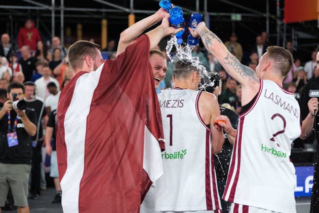 June 7, 2026, Warsaw, Masovian Voivodeship, Poland: Latvia s FRANCIS LACIS (6), KARLIS LASMANIS (2), and ZIGMARS RAIMO (9) pour water on NAURIS MIEZIS (1) as they celebrate victory at the end of the FIBA 3x3 Basketball World Cup men s final game between Latvia and Germany in Warsaw, Poland. Latvia defeated Germany to become world champions. Basketball 2026: FIBA 3x3 World Cup Men s Final: Latvia 20:15 Germany  - ZUMAk204 20260607_zip_k204_061 Copyright: xRomanxKozielx