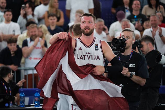 June 7, 2026, Warsaw, Masovian Voivodeship, Poland: Latvia s ZIGMARS RAIMO (9) holds a Latvian flag in victory at the end of the FIBA 3x3 Basketball World Cup men s final game between Latvia and Germany in Warsaw, Poland. Latvia defeated Germany to become world champions. Basketball 2026: FIBA 3x3 World Cup Men s Final: Latvia 20:15 Germany  - ZUMAk204 20260607_zip_k204_062 Copyright: xRomanxKozielx
