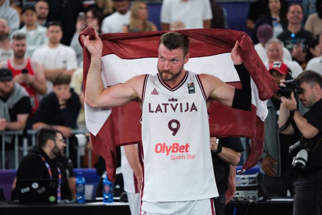 June 7, 2026, Warsaw, Masovian Voivodeship, Poland: Latvia s ZIGMARS RAIMO (9) holds up a Latvian flag over his shoulders in victory at the end of the FIBA 3x3 Basketball World Cup men s final game between Latvia and Germany in Warsaw, Poland. Latvia defeated Germany to become world champions. Warsaw Poland - ZUMAk204 20260607_zip_k204_063 Copyright: xRomanxKozielx