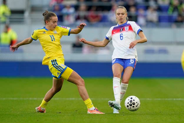Liverpool, England, 9th June 2026. Esme Morgan of England (R) is challenged by Yelyzaveta Molodiuk of Ukraine during the England Women vs Ukraine Women FIFA Women s World Cup Qualifying match at Hill Dickinson Stadium, Liverpool. Picture credit should read: Andrew Yates Sportimage EDITORIAL USE ONLY. No use with unauthorised audio, video, data, fixture lists, club league logos or live services. Online in-match use limited to 120 images, no video emulation. No use in betting, games or single club league player publications. SPI_014_AY_ENG_UKRAINE SPI-4844-0014